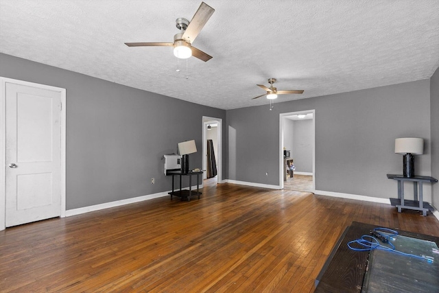 608 Parkview Dr, Chattanooga, TN 37411 - unfurnished living room with a ceiling fan, a textured ceiling, hardwood / wood-style flooring, and baseboards