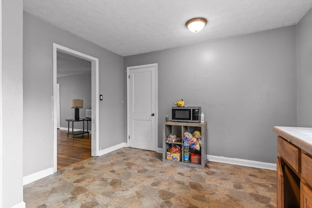 608 Parkview Dr, Chattanooga, TN 37411 - interior space featuring stone finish floors, a textured ceiling, and baseboards