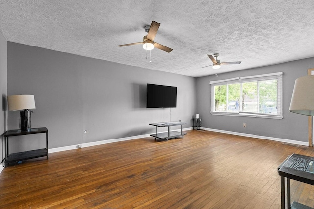 608 Parkview Dr, Chattanooga, TN 37411 - unfurnished living room featuring a ceiling fan, hardwood / wood-style flooring, baseboards, and a textured ceiling