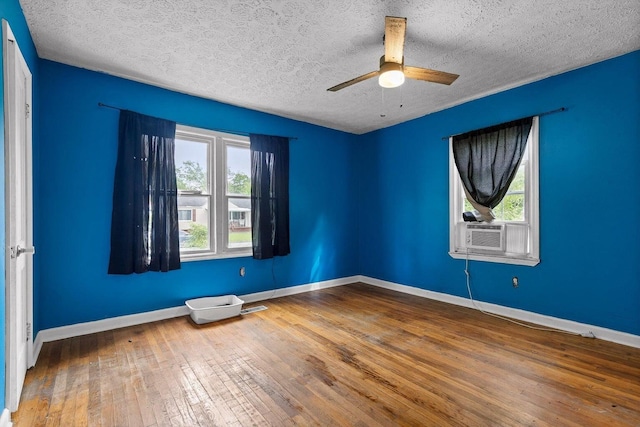608 Parkview Dr, Chattanooga, TN 37411 - spare room featuring plenty of natural light, cooling unit, a textured ceiling, hardwood / wood-style flooring, and ceiling fan