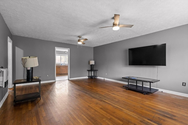 608 Parkview Dr, Chattanooga, TN 37411 - living area featuring a ceiling fan, a textured ceiling, hardwood / wood-style floors, and baseboards