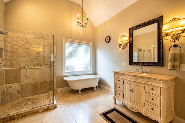 2734 Kensington Park Trl NW, Cleveland, TN 37312 - full bath with a chandelier, a shower stall, a soaking tub, vanity, and tile patterned floors