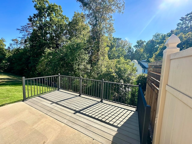 wooden terrace with a yard