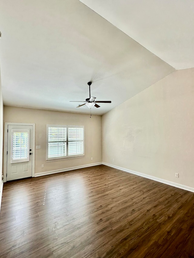 unfurnished room featuring ceiling fan, dark hardwood / wood-style flooring, and lofted ceiling