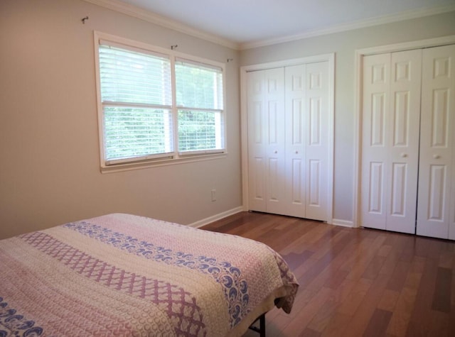 3611 Sourwood Trl NW, Cleveland, TN 37312 - bedroom featuring wood finished floors, two closets, crown molding, and baseboards