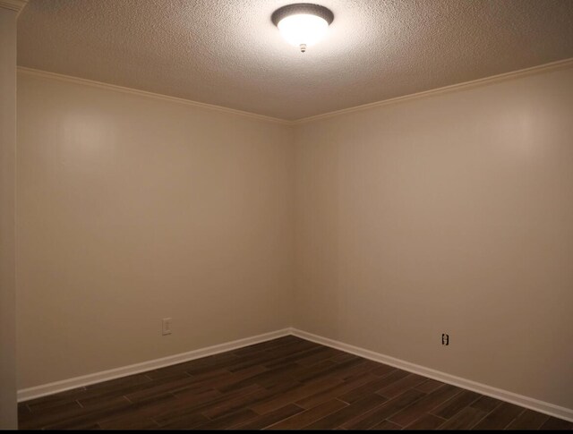 3611 Sourwood Trl NW, Cleveland, TN 37312 - unfurnished room with dark wood-type flooring, ornamental molding, a textured ceiling, and baseboards