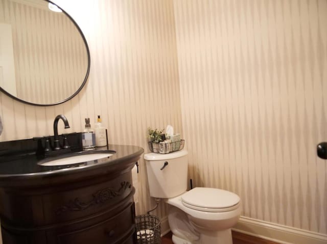 3611 Sourwood Trl NW, Cleveland, TN 37312 - half bath with vanity, toilet, and wood finished floors