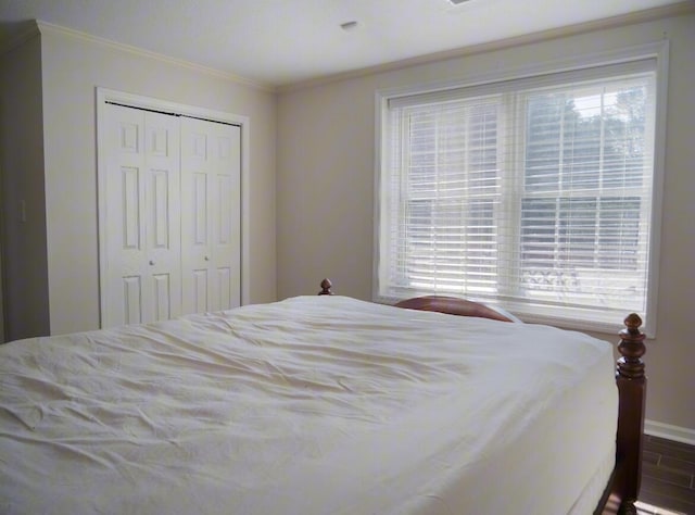3611 Sourwood Trl NW, Cleveland, TN 37312 - bedroom with multiple windows, crown molding, a closet, and baseboards