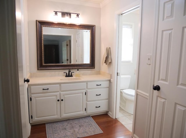 3611 Sourwood Trl NW, Cleveland, TN 37312 - bathroom with vanity, toilet, crown molding, and wood finished floors