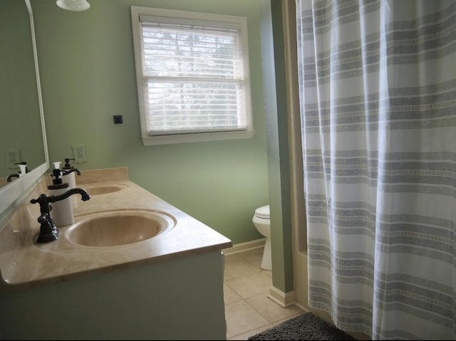 3611 Sourwood Trl NW, Cleveland, TN 37312 - full bath featuring tile patterned floors, double vanity, toilet, and baseboards