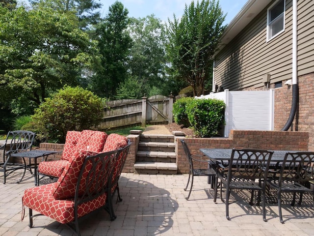3611 Sourwood Trl NW, Cleveland, TN 37312 - view of patio featuring a gate and outdoor dining space