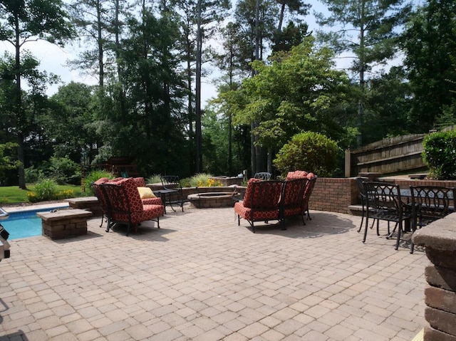 3611 Sourwood Trl NW, Cleveland, TN 37312 - view of patio with a fire pit and view of wooded area
