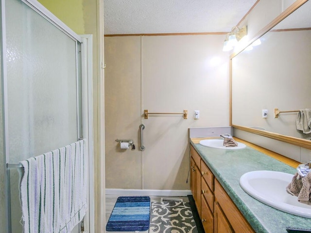 263 County Road 967, Riceville, TN 37370 - bathroom featuring double vanity, a stall shower, and a textured ceiling