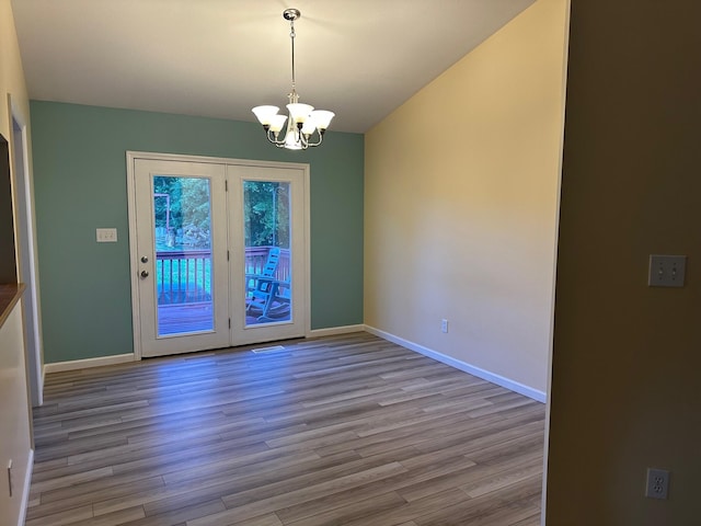 740 Grassy Branch Rd, Dayton, TN 37321 - unfurnished dining area with a chandelier and wood finished floors