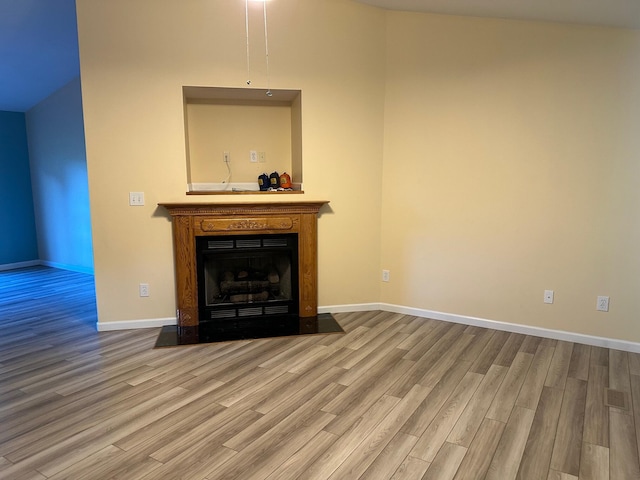 740 Grassy Branch Rd, Dayton, TN 37321 - unfurnished living room with wood finished floors and a fireplace
