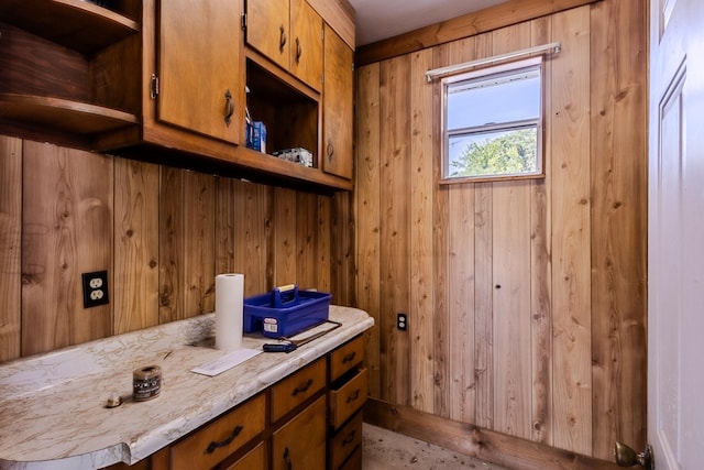 bathroom with wood walls