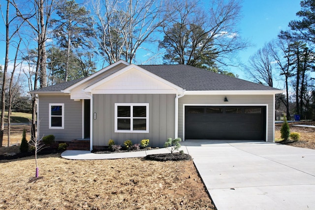 single story home featuring a garage and a front lawn