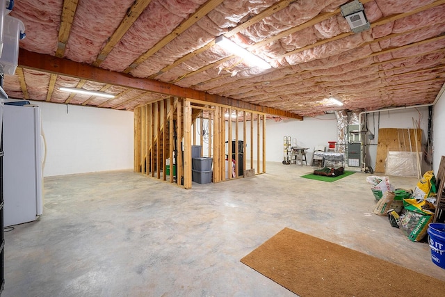 123 Carson Pl, Clinton, TN 37716 - unfinished below grade area featuring freestanding refrigerator and heating unit