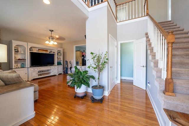 123 Carson Pl, Clinton, TN 37716 - living area with stairway, light wood-type flooring, ceiling fan, and baseboards