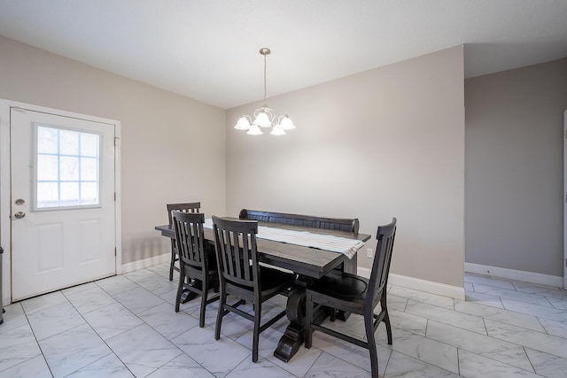 123 Carson Pl, Clinton, TN 37716 - dining room with light marble finish flooring, a chandelier, and baseboards