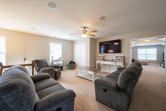 123 Carson Pl, Clinton, TN 37716 - living room with light carpet, a ceiling fan, plenty of natural light, baseboards, and a textured ceiling