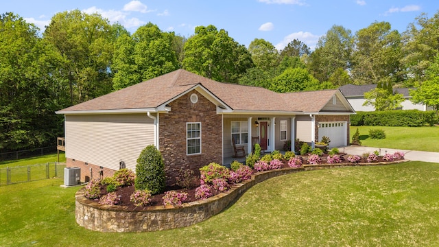 view of front of home featuring an attached garage, a porch, stone siding, and a front lawn