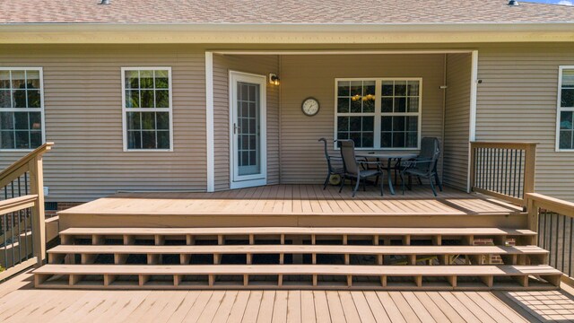 wooden deck with outdoor dining area