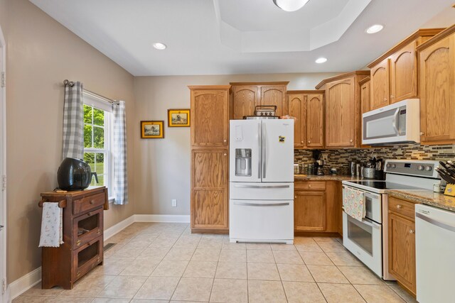 full bath featuring curtained shower, tile patterned flooring, toilet, vanity, and crown molding