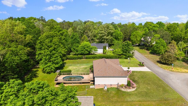 aerial view featuring a wooded view