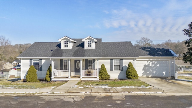 view of front of property with a porch and a garage