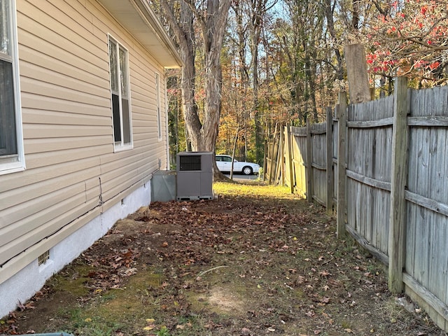 view of yard featuring central air condition unit