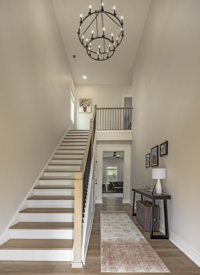 1282 No Pone Rd NW, Georgetown, TN 37336 - stairs featuring high vaulted ceiling, a chandelier, and wood finished floors