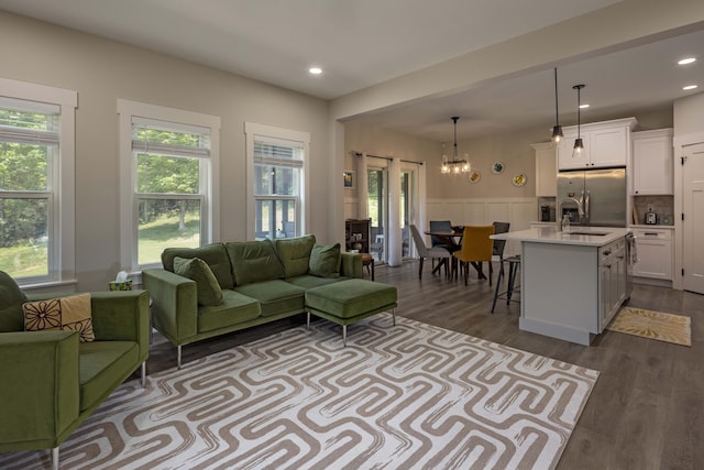 1282 No Pone Rd NW, Georgetown, TN 37336 - living area featuring a chandelier, plenty of natural light, dark wood finished floors, a wainscoted wall, and recessed lighting