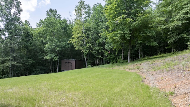 1282 No Pone Rd NW, Georgetown, TN 37336 - view of grassy yard with a storage shed and a view of trees