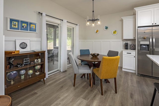 1282 No Pone Rd NW, Georgetown, TN 37336 - dining area with wood finished floors, wainscoting, a chandelier, and a decorative wall