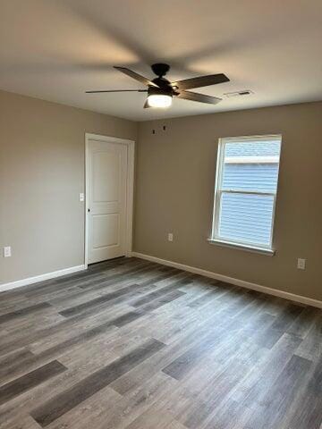 empty room with wood-type flooring and ceiling fan