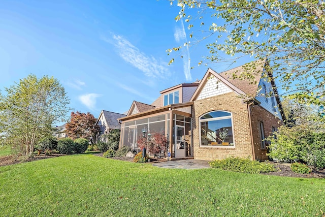 944 Ironwood Ln, Loudon, TN 37774 - back of property with a sunroom, a yard, and a patio