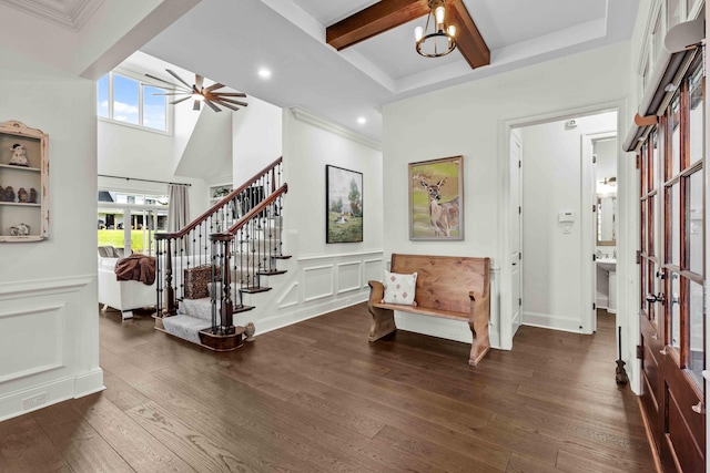 944 Ironwood Ln, Loudon, TN 37774 - foyer entrance with ceiling fan with notable chandelier, a healthy amount of sunlight, and dark wood-type flooring