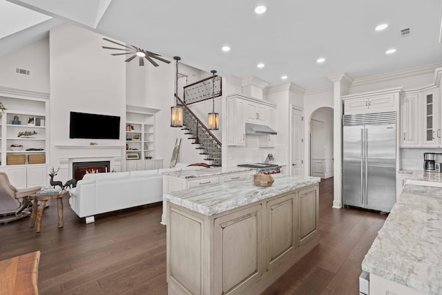 944 Ironwood Ln, Loudon, TN 37774 - kitchen featuring a center island, light stone countertops, appliances with stainless steel finishes, and built in features