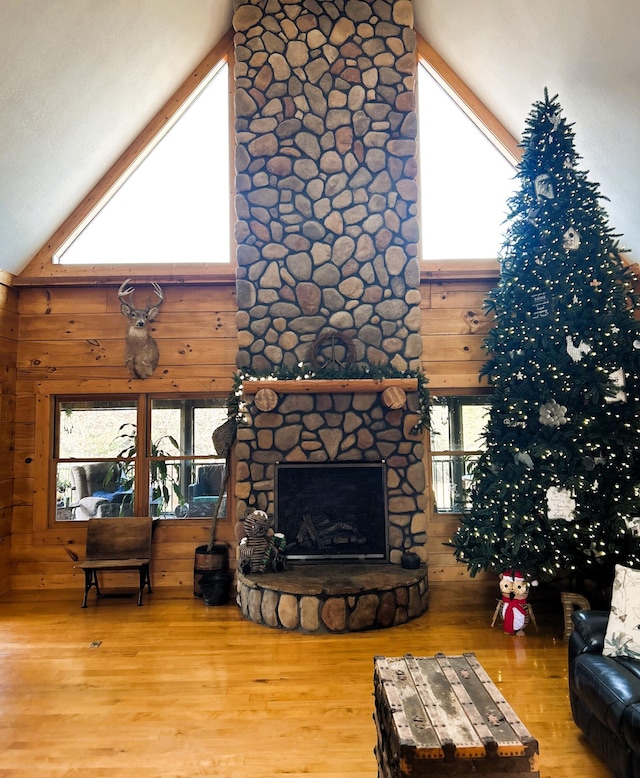 living room featuring hardwood / wood-style flooring and high vaulted ceiling