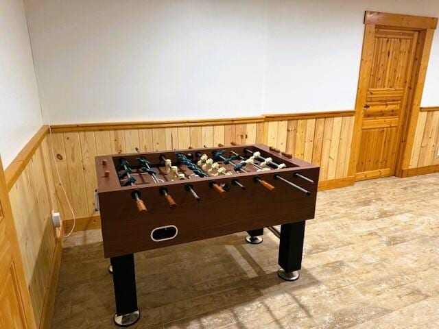 playroom featuring wood walls