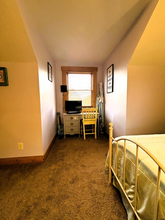 carpeted bedroom featuring lofted ceiling