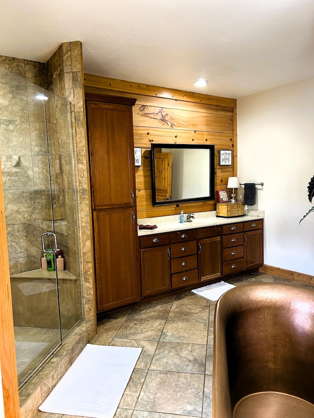 bathroom with vanity and an enclosed shower