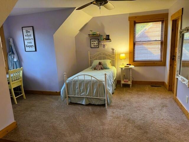 carpeted bedroom with ceiling fan and lofted ceiling