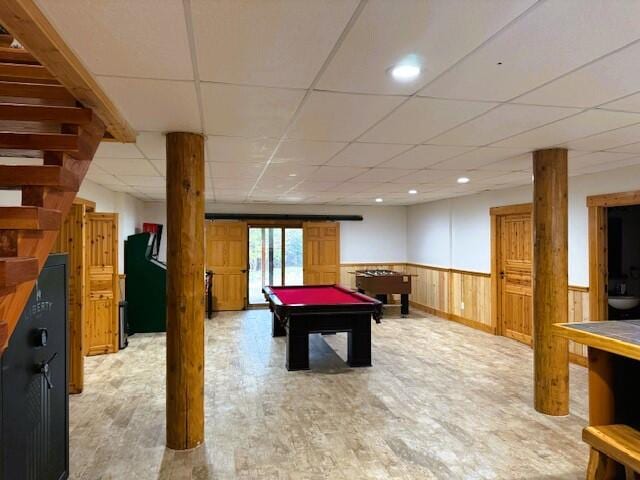 game room featuring a paneled ceiling, pool table, and light wood-type flooring