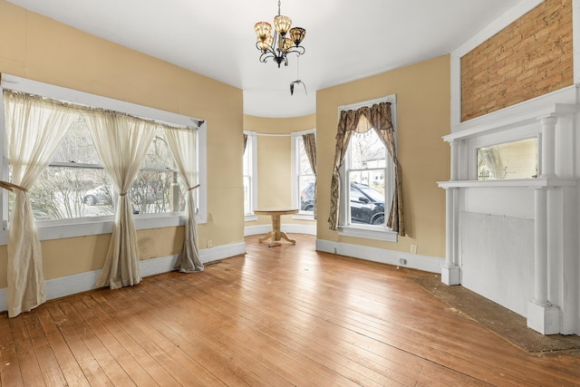 interior space featuring hardwood / wood-style floors and a chandelier