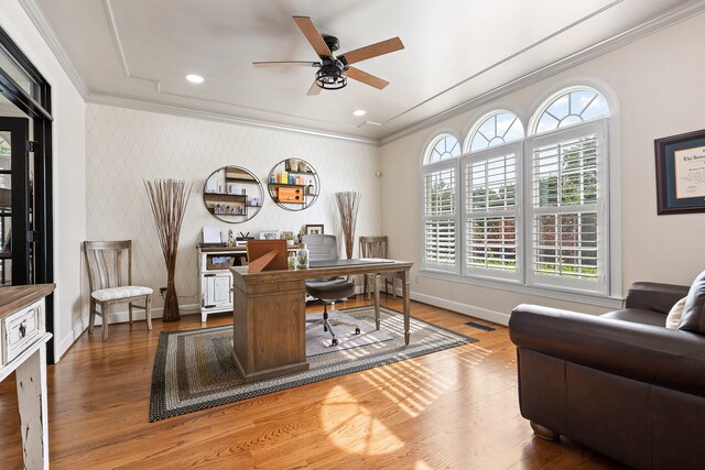 office space with ceiling fan, ornamental molding, and hardwood / wood-style flooring