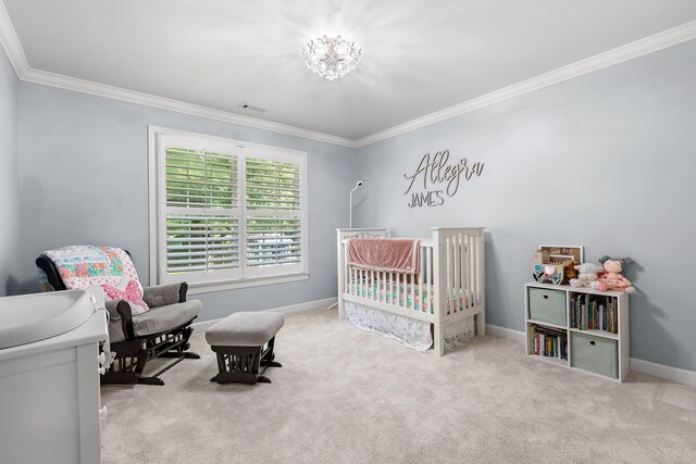 bedroom with light colored carpet, a nursery area, and ornamental molding