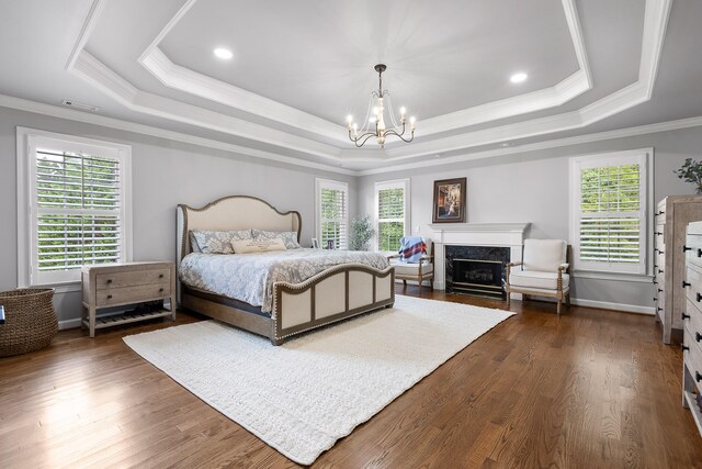 bedroom featuring multiple windows, crown molding, and dark wood-type flooring