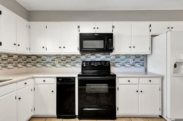 kitchen featuring white cabinets, light tile patterned floors, backsplash, and black appliances